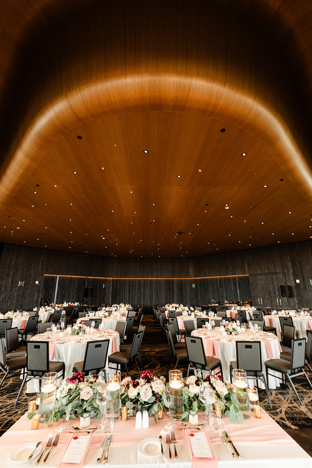 Modern Calgary ballroom set with blush linens and candlelight